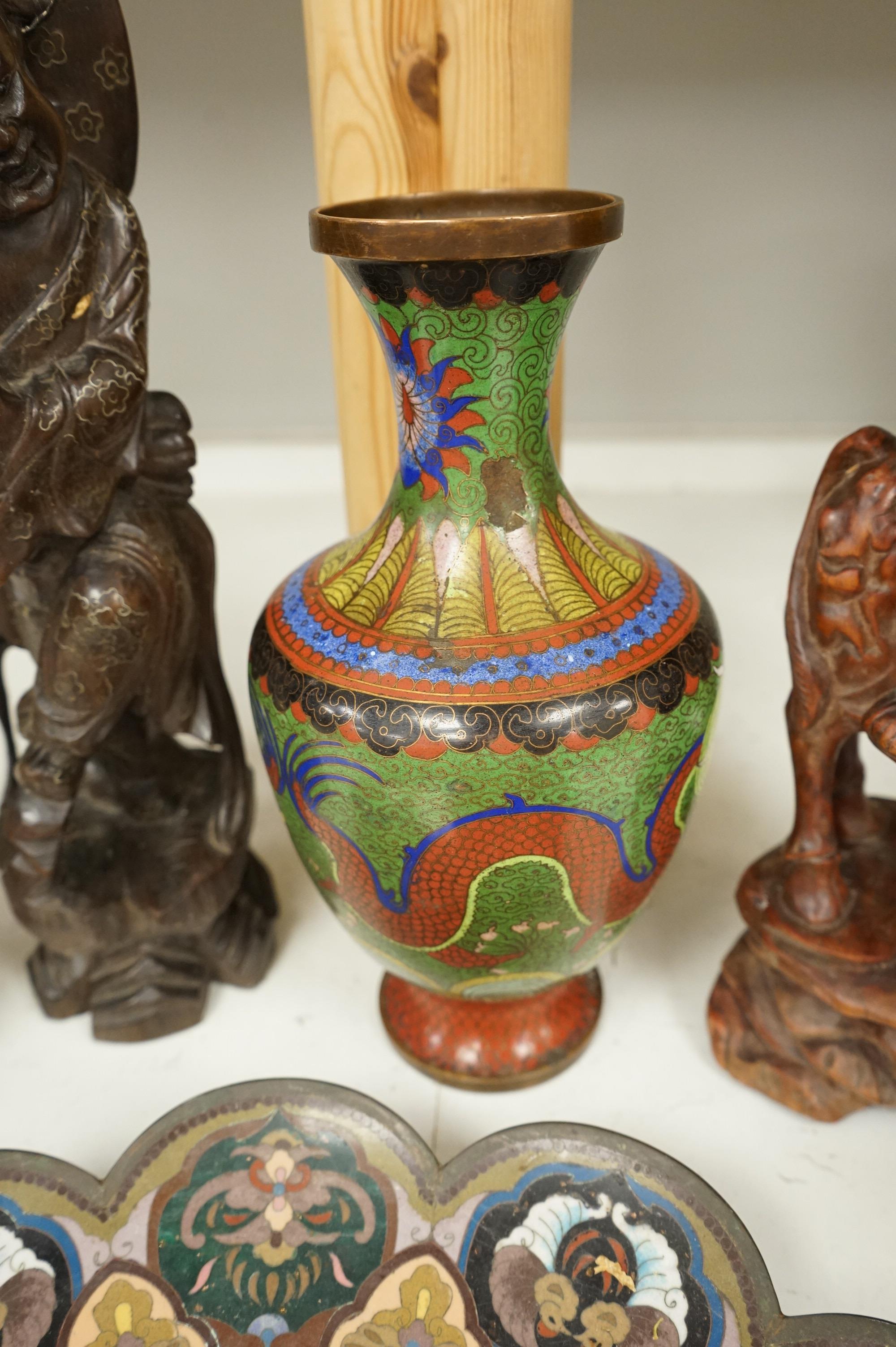 A Japanese cloisonne plate, a cloisonne vase and three Chinese carved wood figures, largest 39cm high